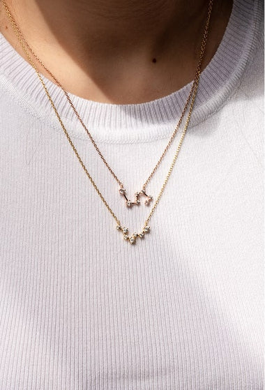 Layered gold necklaces